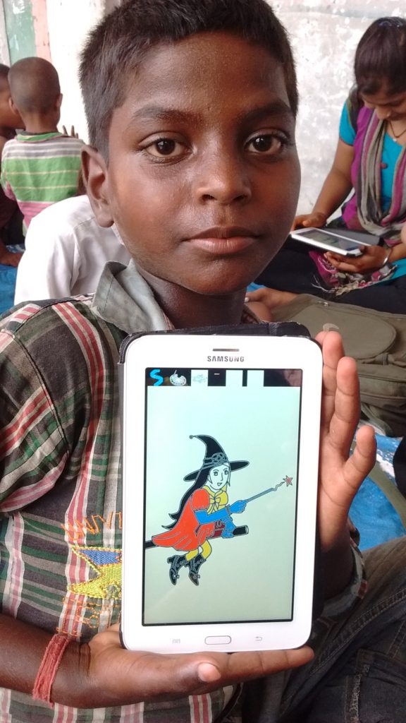 Monu with the picture he created using the tablet