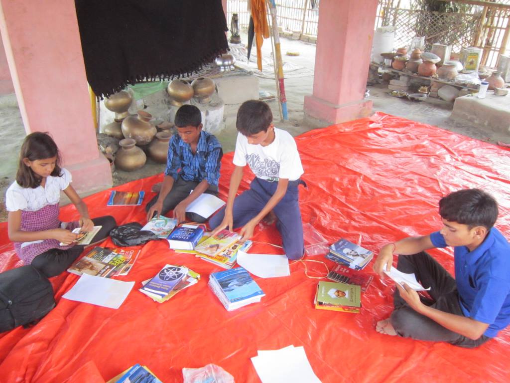 Students reading the books from the Community Library